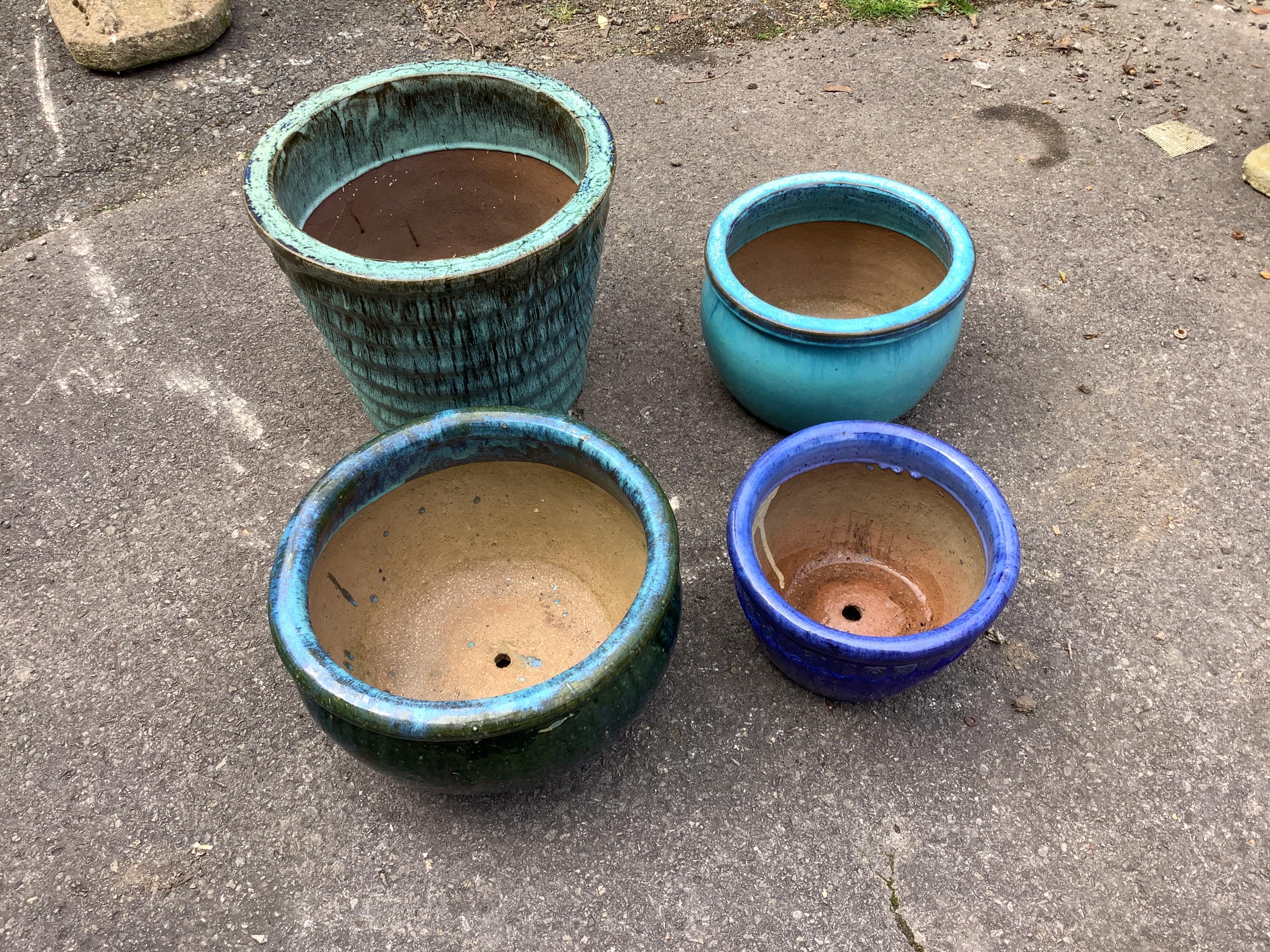 Four glazed earthenware circular garden planters, largest diameter 38cm, height 31cm